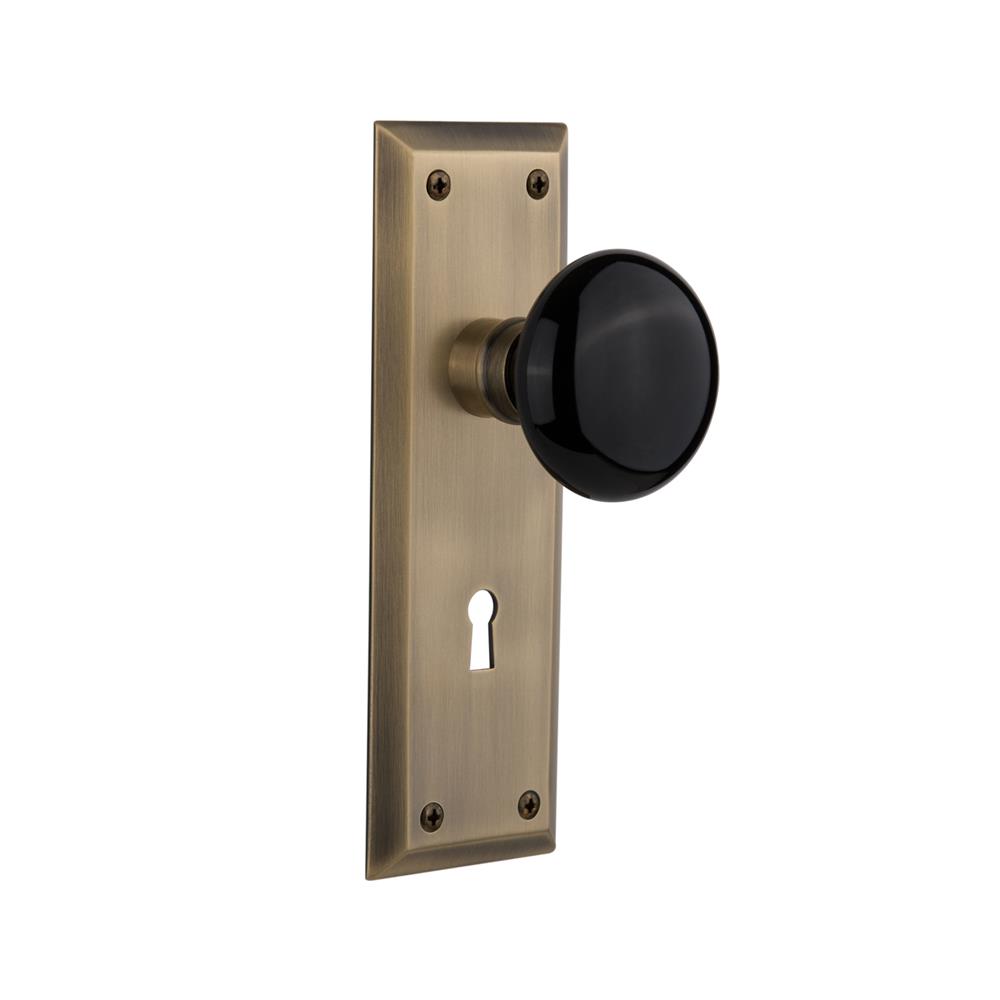 Nostalgic Warehouse NYKBLK Mortise New York Plate with Black Porcelain Knob with Keyhole in Antique Brass